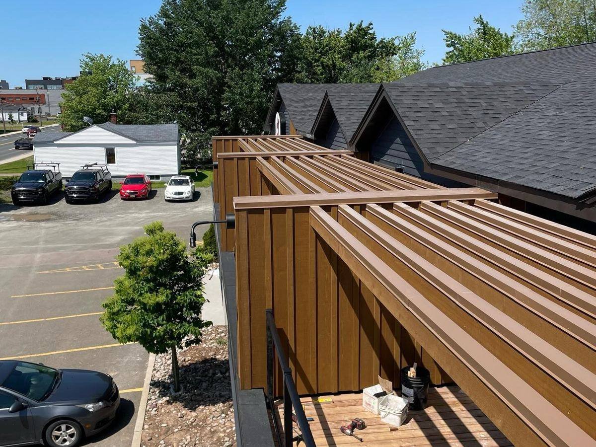 Roof-level slat screen and shingle detail